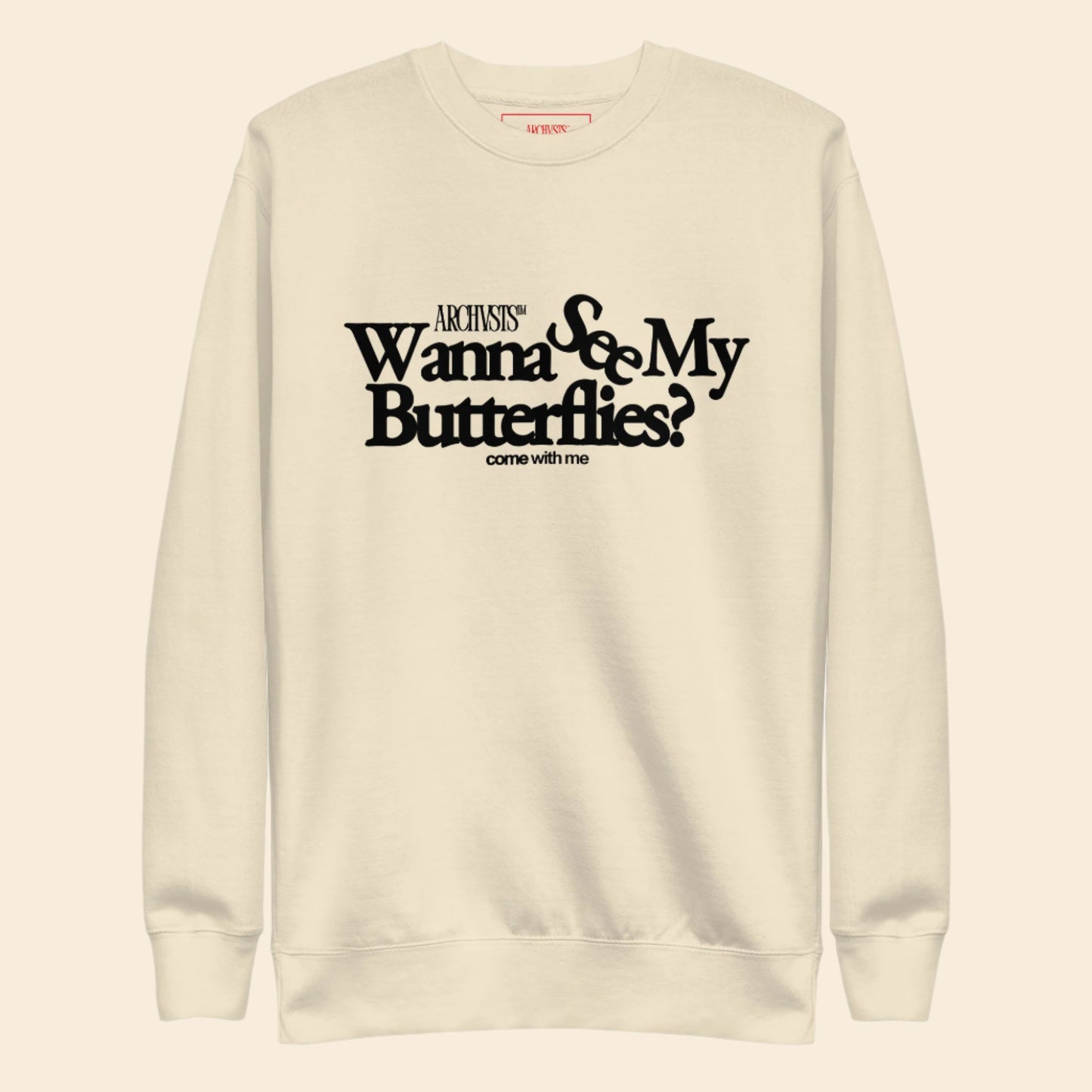 Beige sweatshirt with black text wanna see my butterflies on a white background