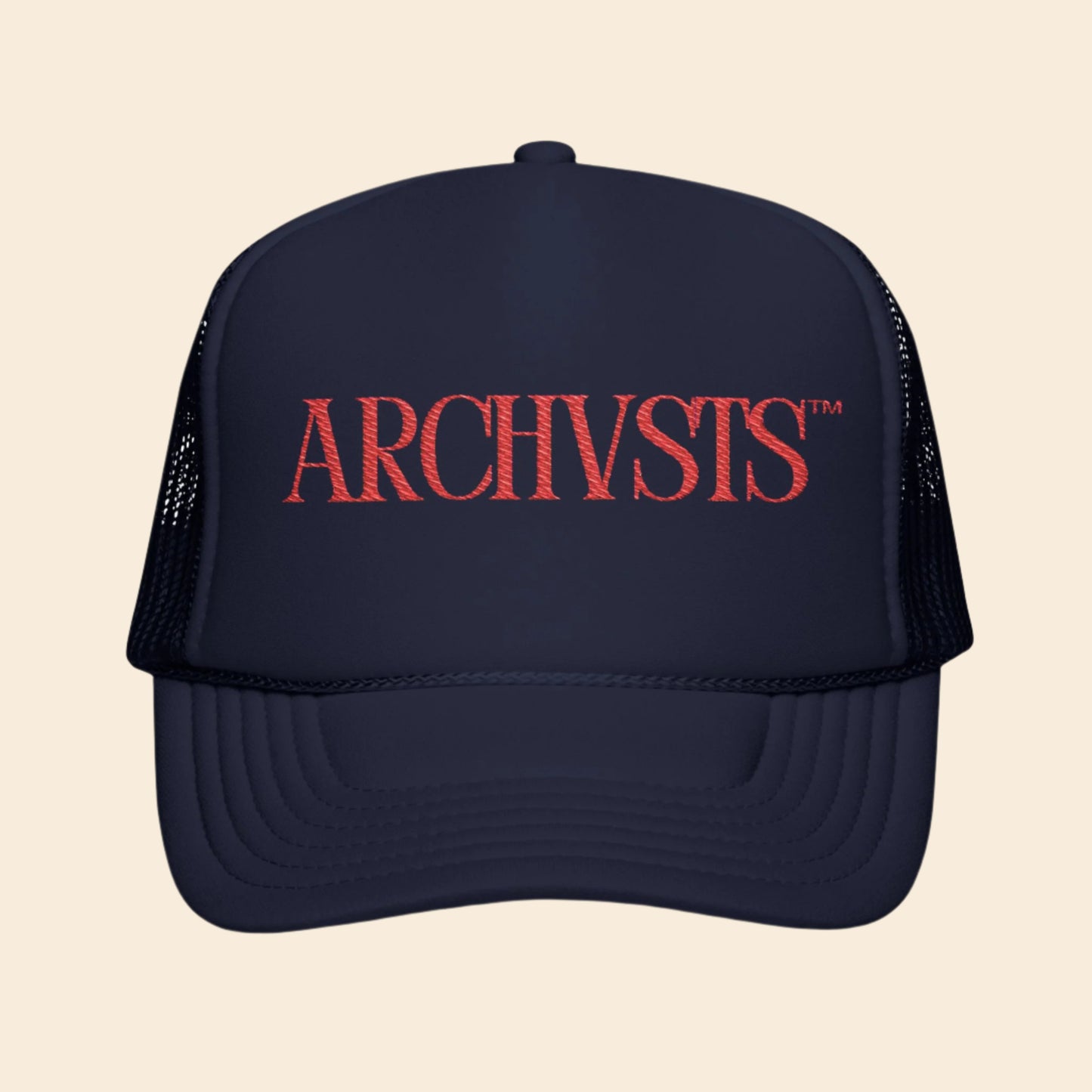 Navy blue trucker hat with red 'ARCHVSTS' logo on a white background