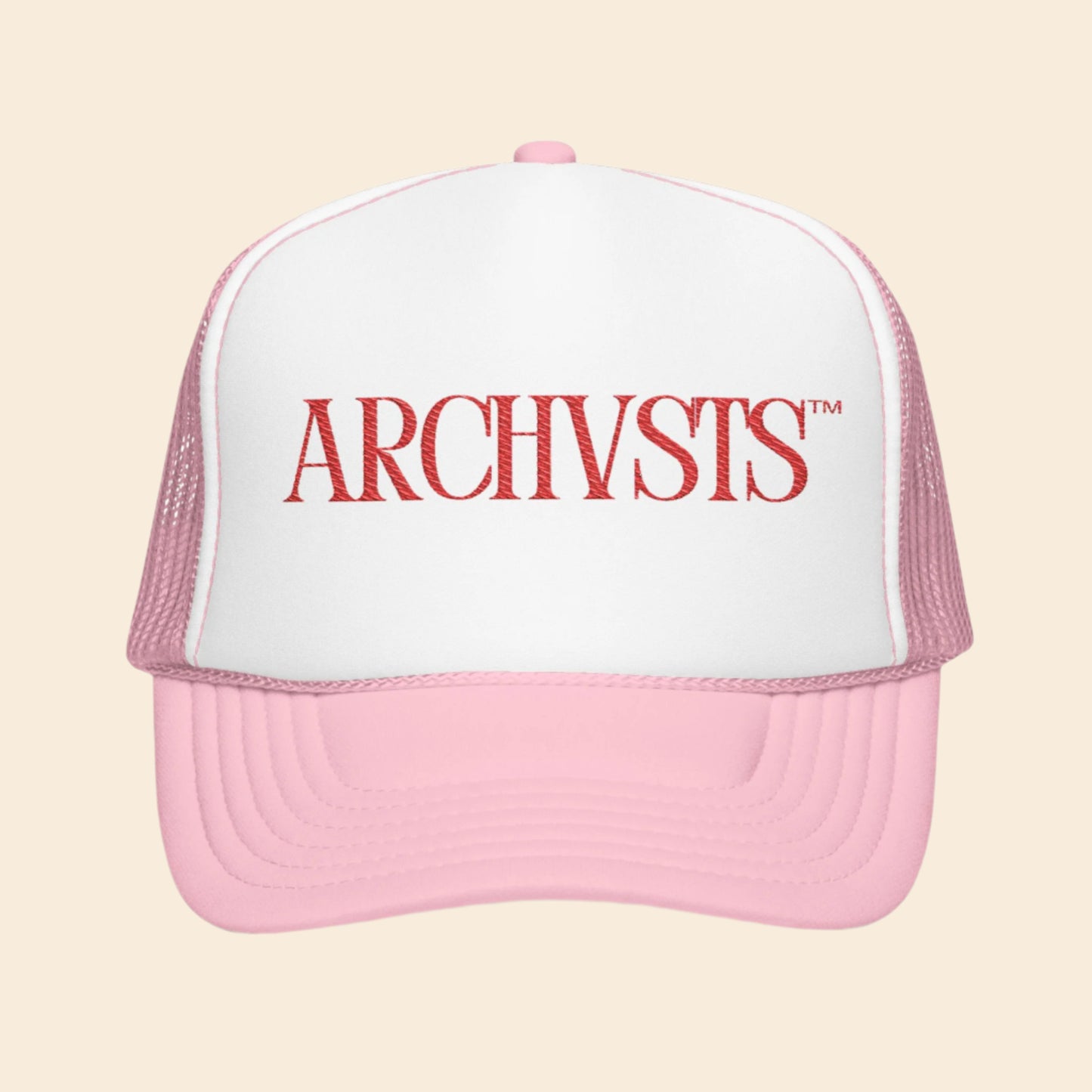 Pink and white cap with 'ARCHVSTS' logo on a white background