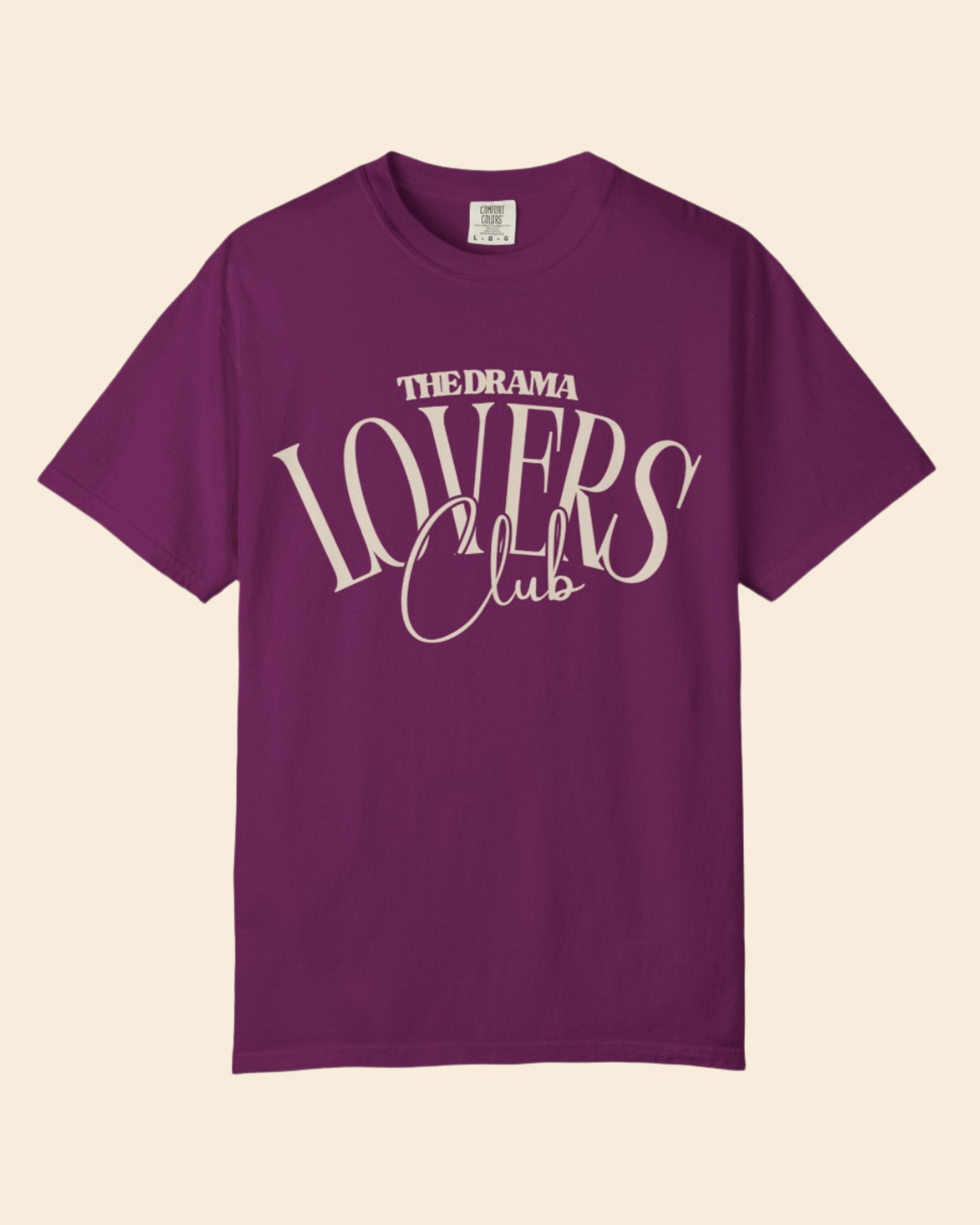 Purple t-shirt with 'The Drama Lovers Club' text on a white background