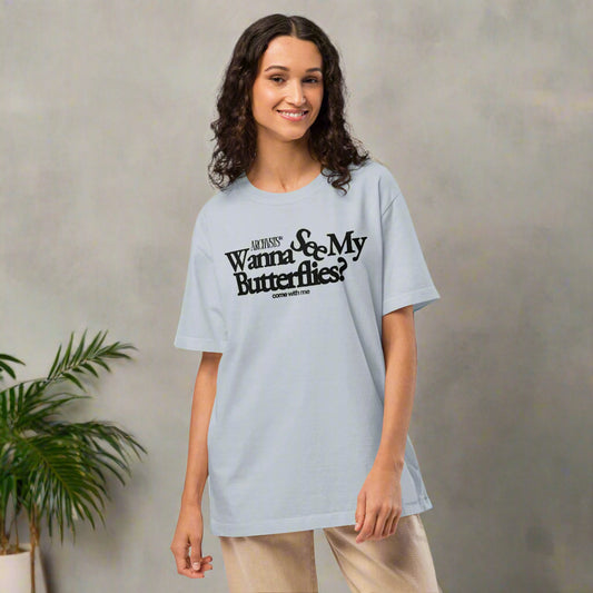 Woman wearing a light blue  ARCHVSTS™ "Wanna See My Butterflies?" Vintage Oversized Tee