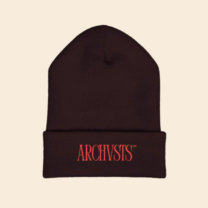Brown beanie with red 'ARCHVSTS' logo on a white background