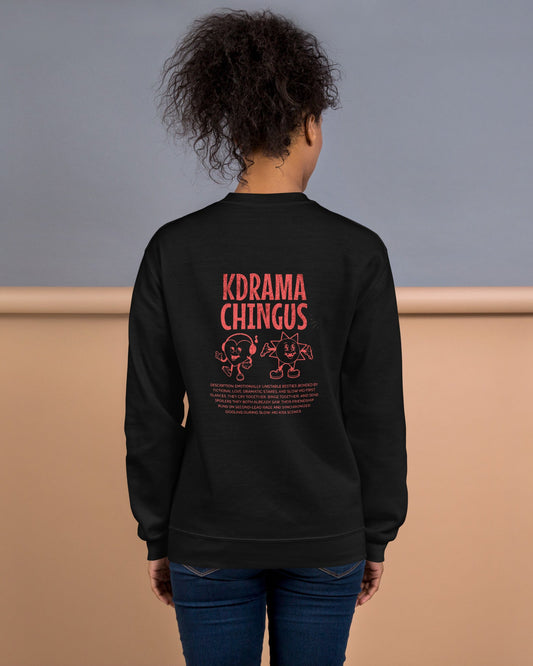 Person wearing a black sweatshirt with 'KDRAMA CHINGUS' text on the back, standing against a gray and beige background.