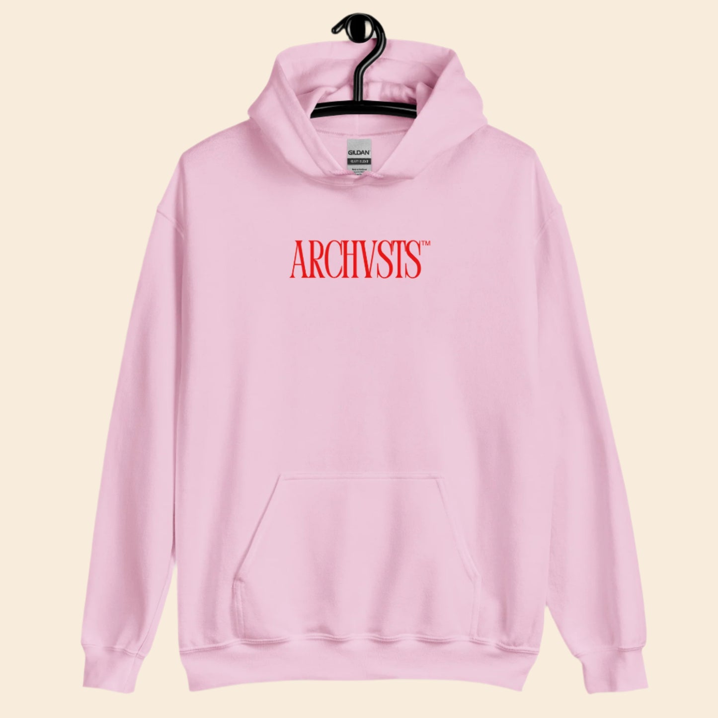 Pink hoodie with 'ARCHIVSTS' text on a hanger against a white background