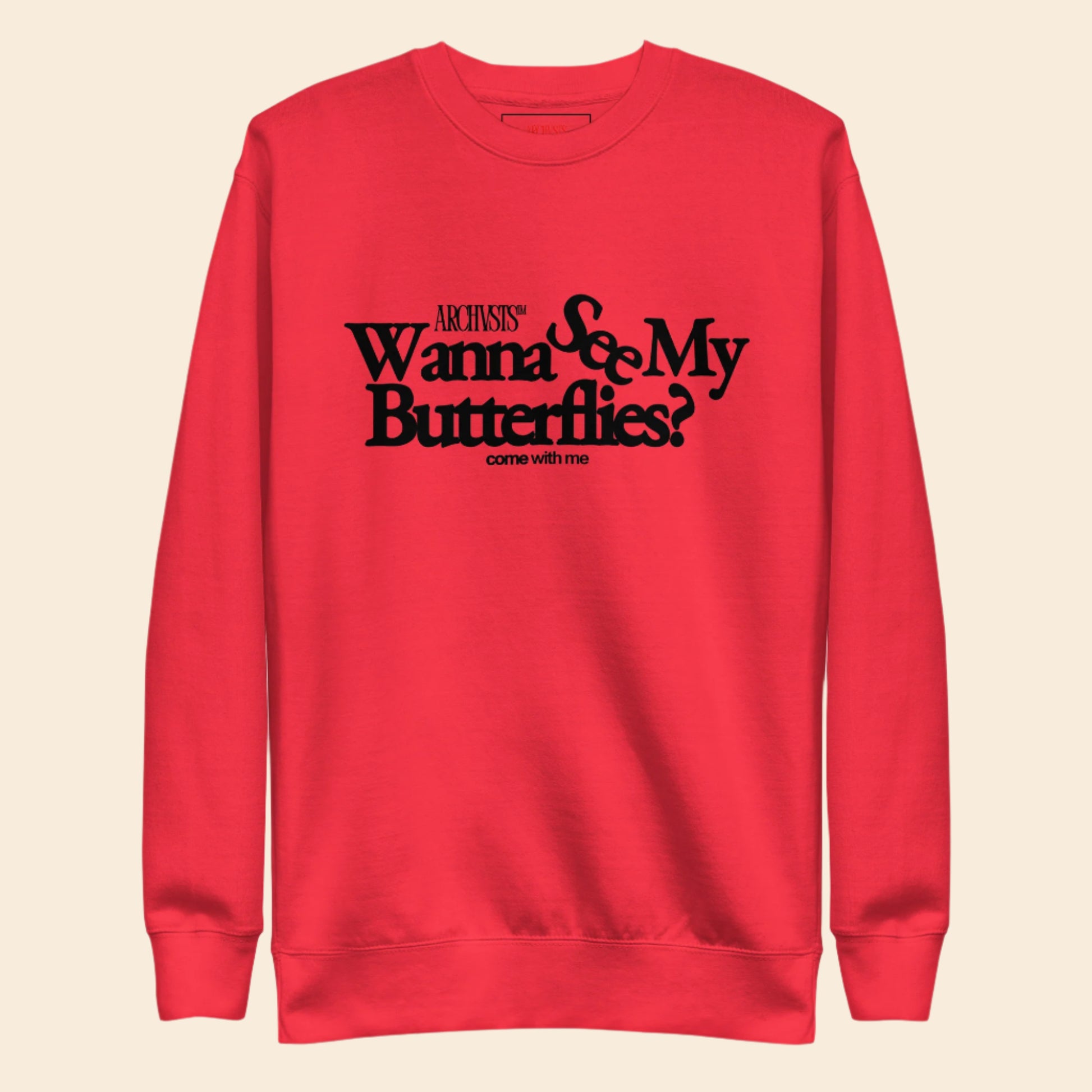 Red sweatshirt with black text wanna see my butterflies  on a white background