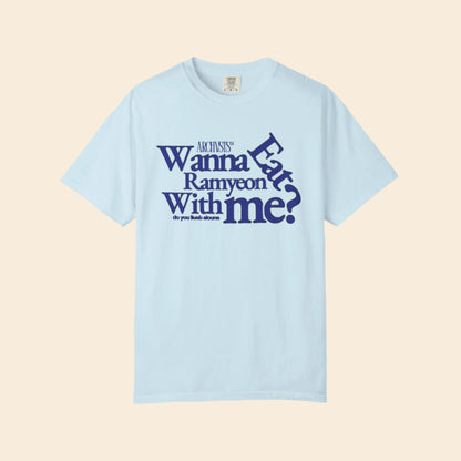 Light blue t-shirt with blue text wanna eat ramenyon with me on a white background