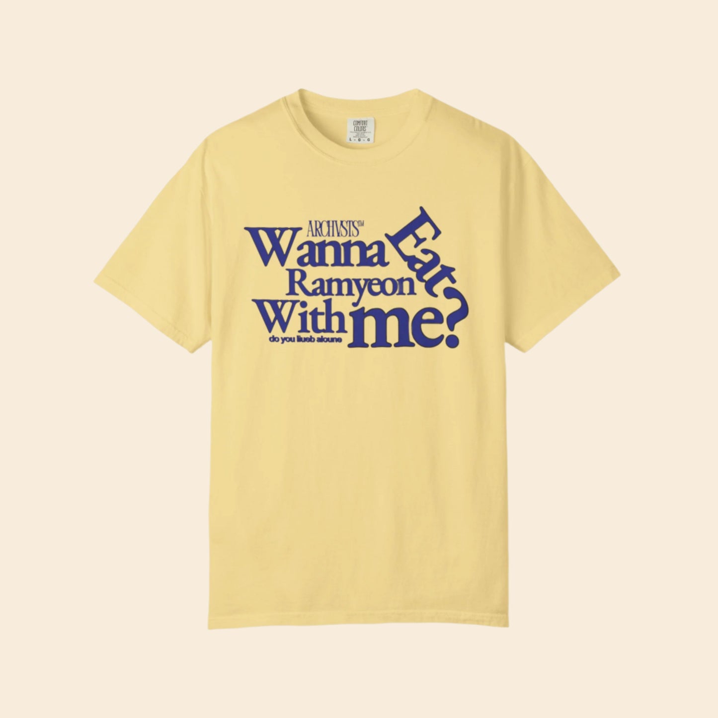 Yellow t-shirt with blue text wanna eat ramenyon with me on a white background