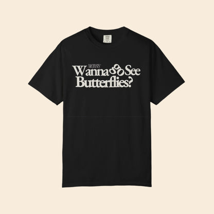 Black t-shirt with white text 'Wanna See Butterflies?' on a white background