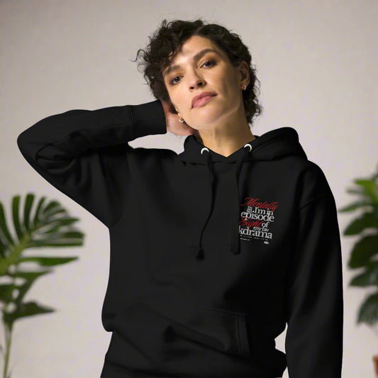 Person wearing a black hoodie with text design mentally I am on episode 8 hoodie on a white background